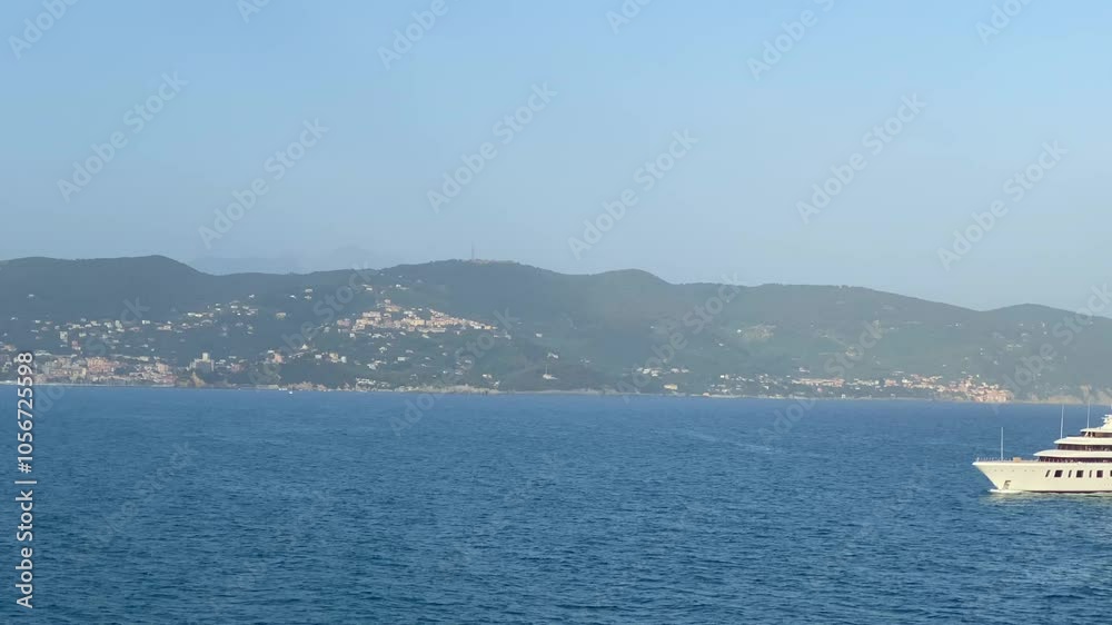 Luxury white yacht entering port of La Spezia, Italy, blue ocean, day Luxury white yacht entering port of La Spezia, Italy, blue ocean, day
