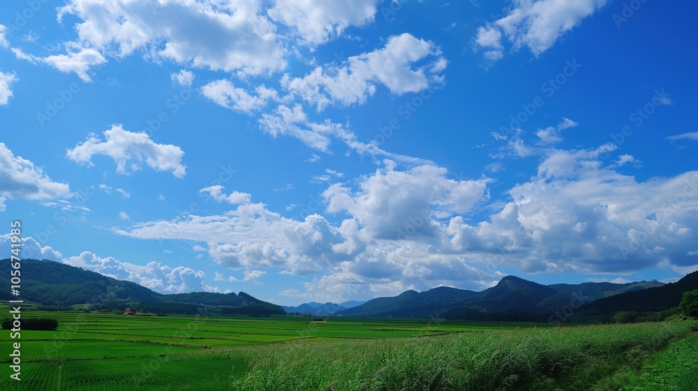 The allure of a landscape filled with the beauty of blue sky, fluffy white clouds, majestic high mountains, and vibrant green plants. Generative AI The allure of a landscape filled with the beauty of blue sky, fluffy white clouds, majestic high mountains, and vibrant green plants. Generative AI