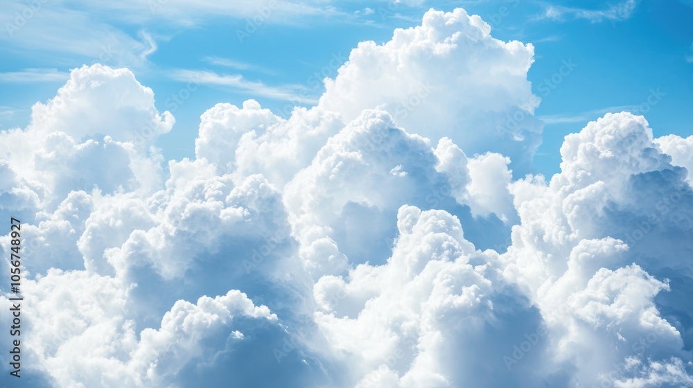 Fluffy white clouds contrast with a bright blue sky at the frame s base featuring ample copy space Ideal for a natural sky backdrop Fluffy white clouds contrast with a bright blue sky at the frame s base featuring ample copy space Ideal for a natural sky backdrop