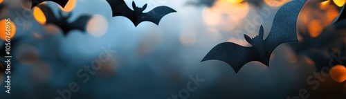 Silhouettes of bats are suspended against a blurred, warm-light background, creating an eerie atmosphere suitable for Halloween-themed projects, party decorations, or spooky storytelling, photo