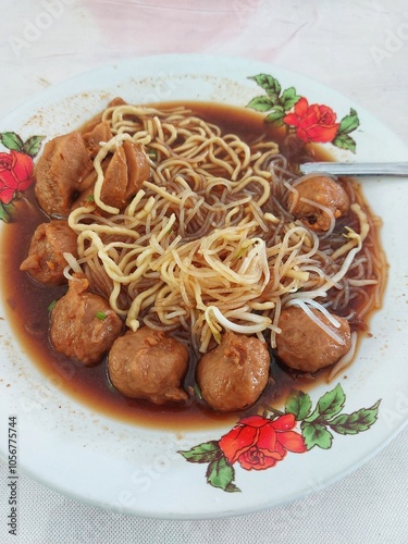 Indonesian Famous Foodstreet Bakso / Meatballs served with noodles and rice noodles
 photo