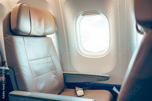 First-class seat detail with ample legroom and superior comfort