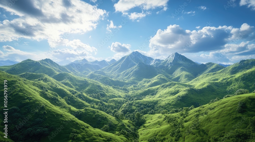 Obraz premium A mountainous landscape featuring lush green hills and a bright blue sky