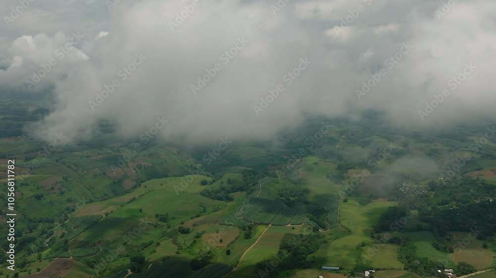 Agricultural fields and farm with floating clouds. Mindanao, Philippines. Agricultural fields and farm with floating clouds. Mindanao, Philippines.