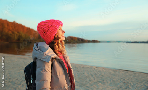 Travel, adventure, traveler woman on the beach looking at sunset, enjoying landscape, on sea coast