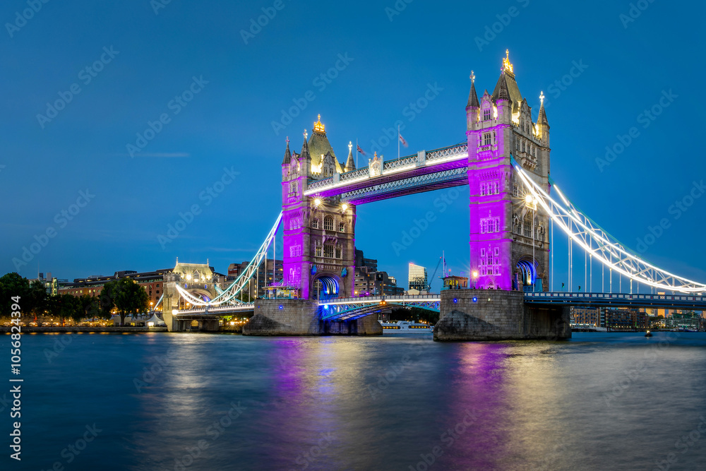 The Tower Bridge and the river Thames at night in London, UK
