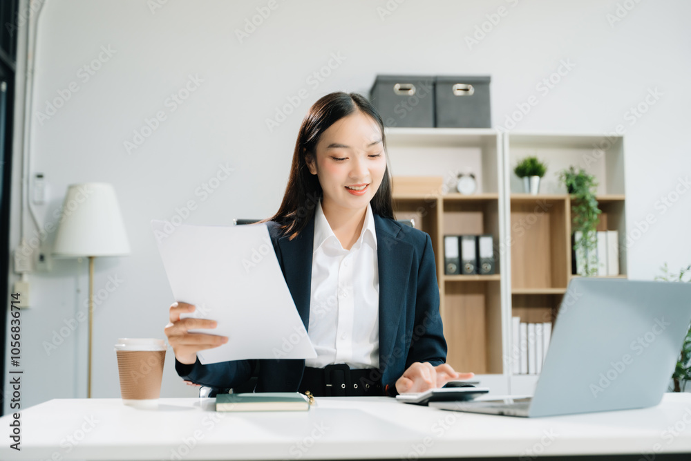 Business woman using tablet and laptop for doing math finance on an office desk, Business woman using tablet and laptop for doing math finance on an office desk,