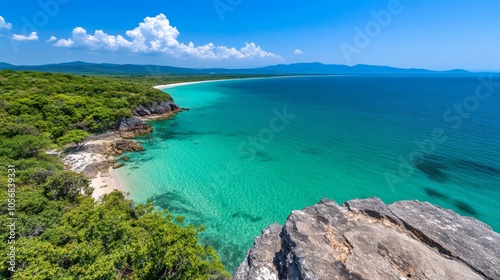 Tropical Island Coastline with Crystal Clear Water and Lush Greenery