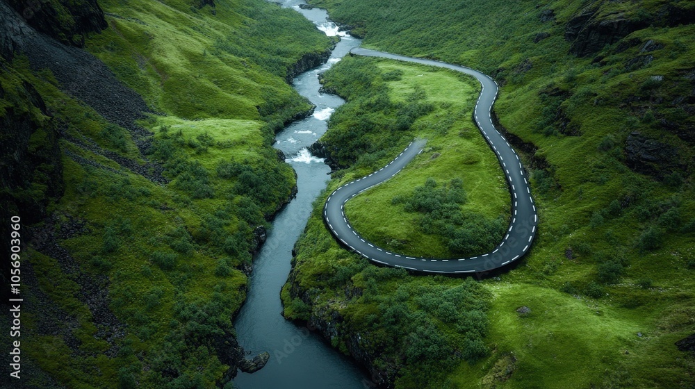 Winding Road Through Lush Green Valley with River Aerial View Winding Road Through Lush Green Valley with River Aerial View