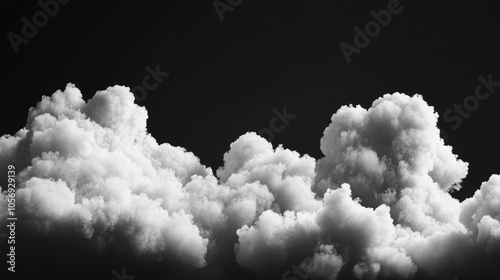 Fluffy white clouds of different sizes set against a dark background