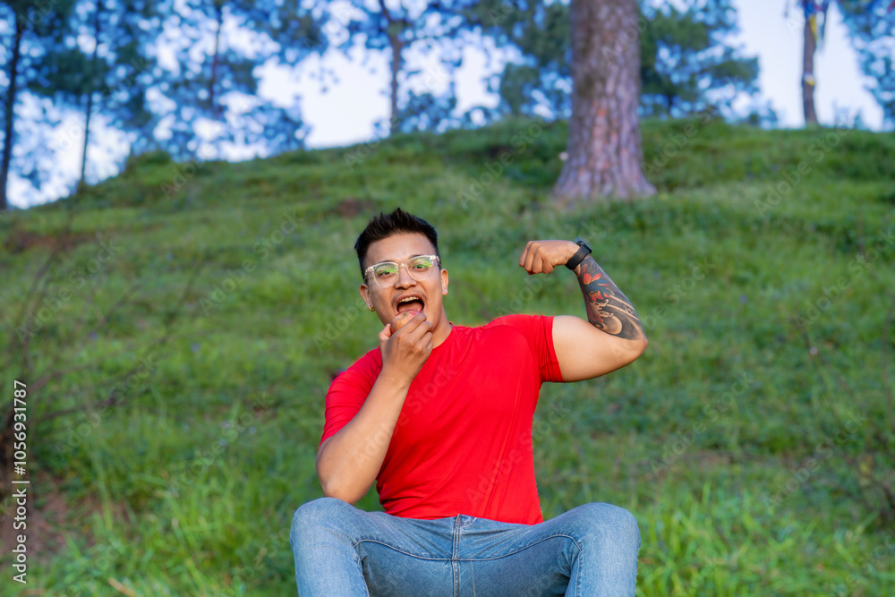 Young Healthy and Fit Athlete eats Apple Banana Citrus Fruit During a Picnic Hike in Green Nature Young Healthy and Fit Athlete eats Apple Banana Citrus Fruit During a Picnic Hike in Green Nature