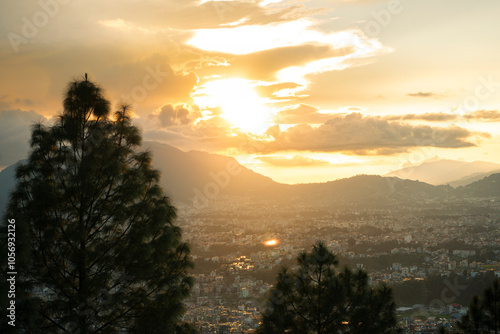 Beautiful Sunset Golden Hour of Kathmandu Valley City in Nepal with Mountains and trees photo