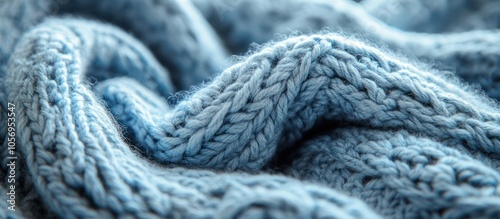 Close-up of blue knitted fabric with soft texture.