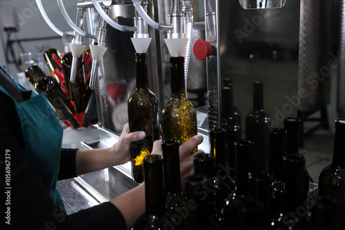 Wine is bottled. Craft winery. Empty wine bottles. Small wine production. Author's wine of the new harvest.