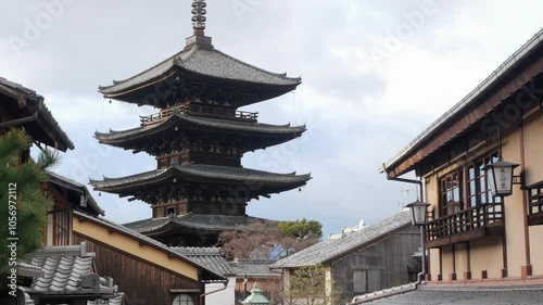landscape street alley view leads to Pagoda of Hokanji Temple or Yasaka no tou (Yasaka Pagoda) in ancient kyoto downtown in daytime surrounding with ancient machiya or kyoto town house style