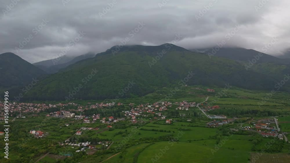 4k Hyperlaps Aerial view of Rila Mountain with rural houses and Rila Mountain Bulgaria on horizon 4k Hyperlaps Aerial view of Rila Mountain with rural houses and Rila Mountain Bulgaria on horizon