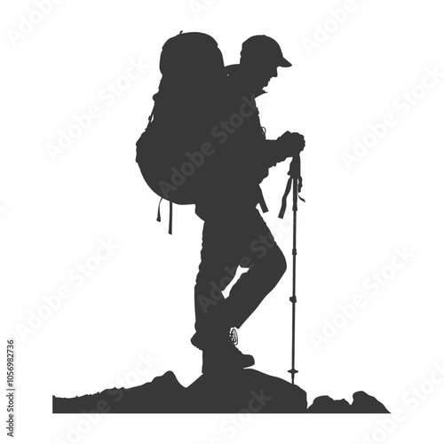 Silhouette of a Hiker with Backpack and Trekking Pole on a Mountaintop