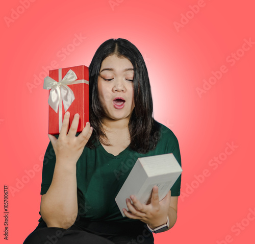 Photography young woman santa chubby beautiful asian one person standing smile cheerful happiness enjoy on theme chrimas eve, new year birhday hand holding box gft on isolated red pink blackground photo