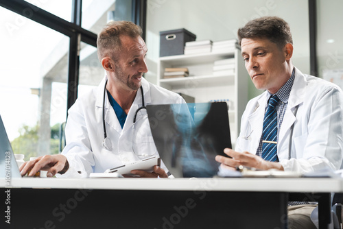 Medical team working on digital tablet healthcare doctor technology tablet using x-ray film analyzed the results of medical reports.