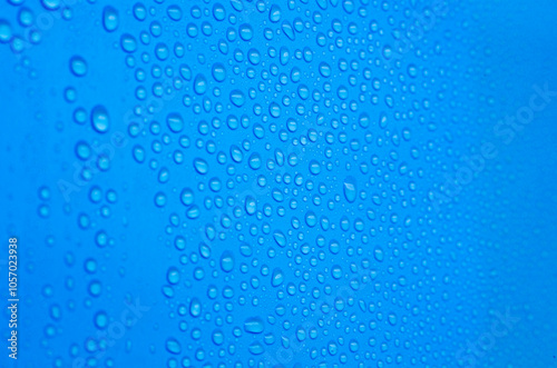 Rain water droplets on blue color background. Water droplets concept and suitable for wallpaper