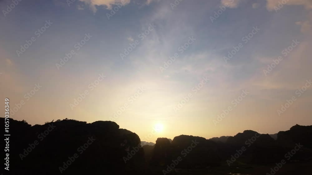 Silhouette of mountain and hills top during sunset time, Ninh Binh Vietnam Silhouette of mountain and hills top during sunset time, Ninh Binh Vietnam