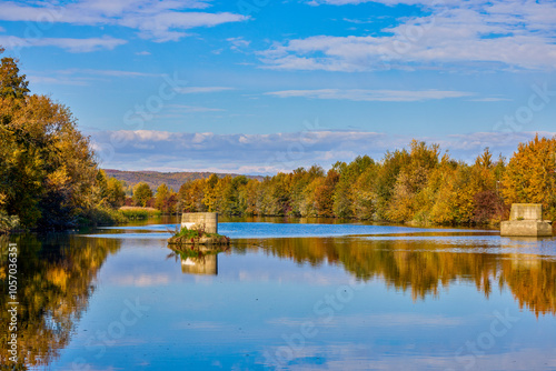 beautiful autumn landscape on a river on a sunny day