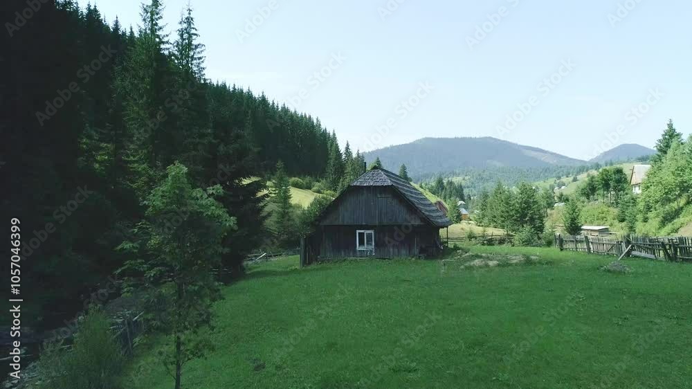 Wooden farm house on green summer field, summer field and farmstead, country home lush grass, rural life and countryside charm summer scenery Wooden farm house on green summer field, summer field and farmstead, country home lush grass, rural life and countryside charm summer scenery