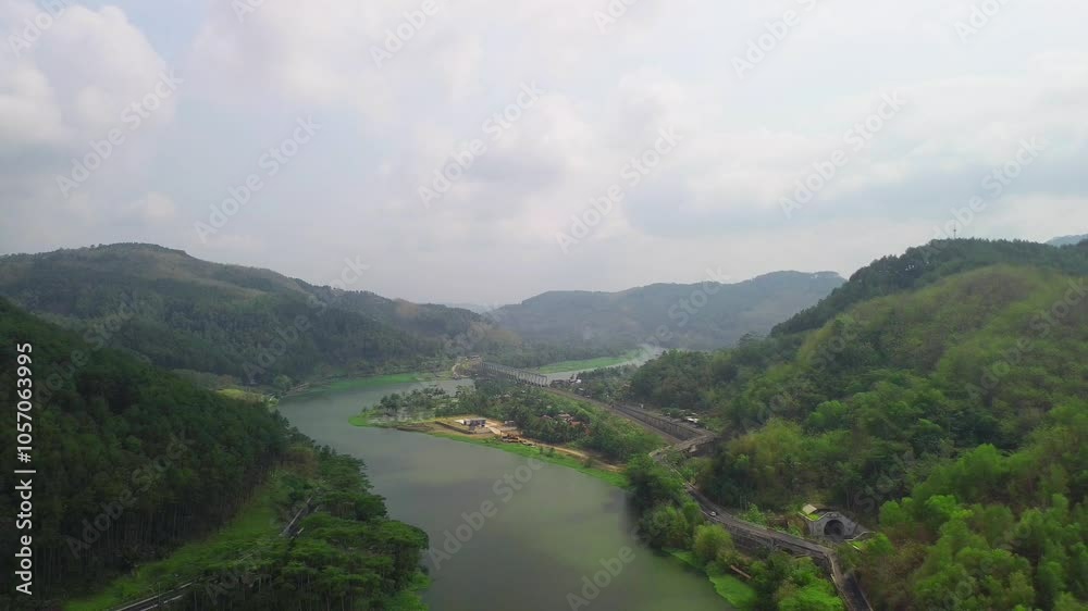 Drone view of surrounding hills, mountains, forests, trees, highways and railway tracks Drone view of surrounding hills, mountains, forests, trees, highways and railway tracks