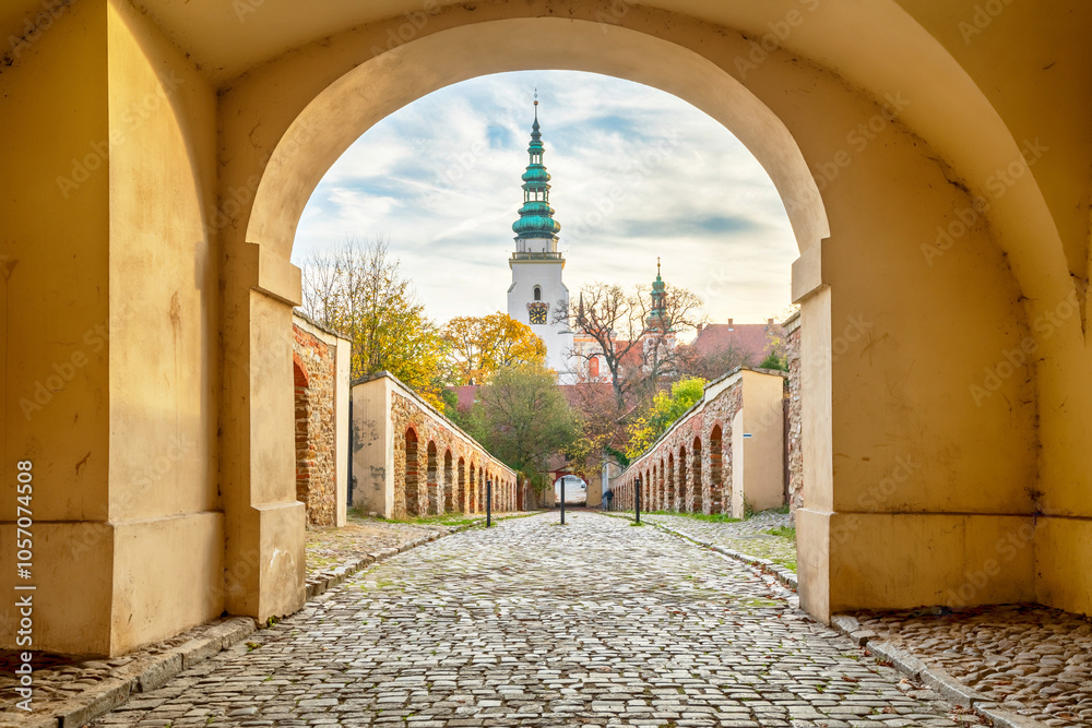 Abbey of Henrykow, Poland. View of bell tower throug an entrance arch