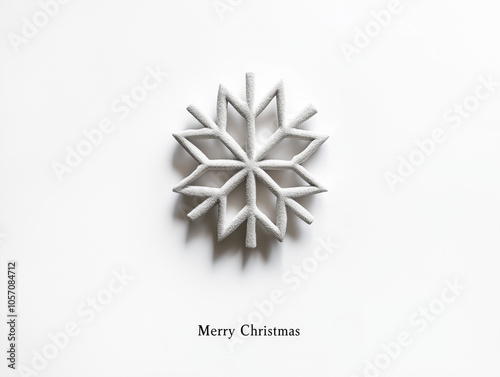 A minimalistic Christmas poster design featuring a single, stylized snowflake in the center of a plain white background