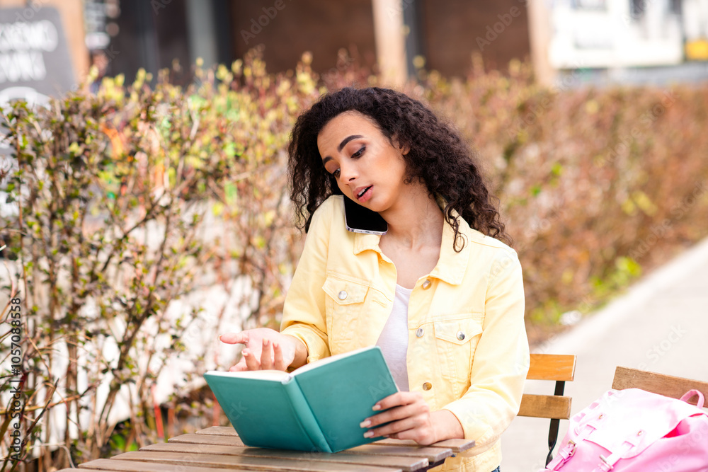 Fototapeta premium Photo of nice pretty young girl speak phone read book fresh air street cafe outdoors