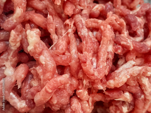 Raw minced meat full background textured. Closeup chopped fresh meat.