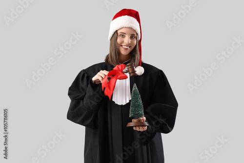 Female judge in Santa hat w...