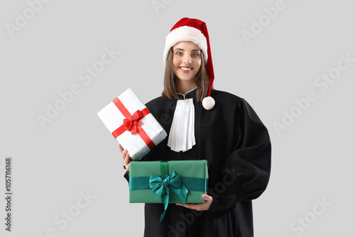Female judge in Santa hat w...