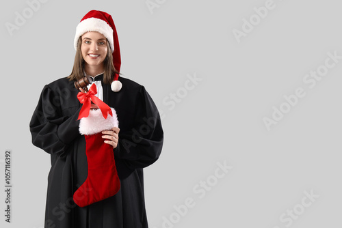 Female judge in Santa hat w...