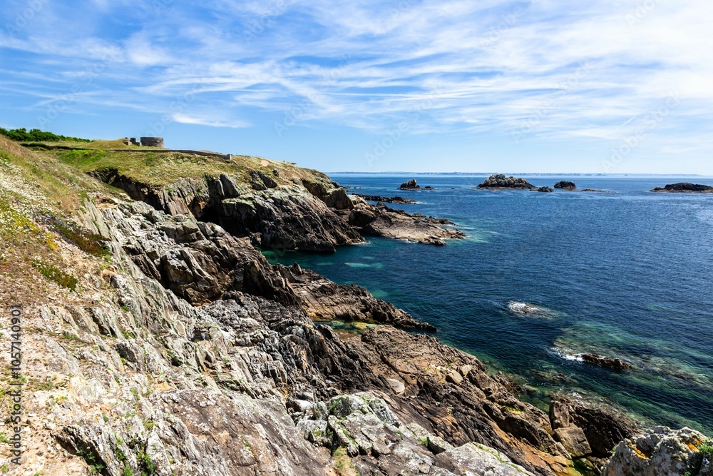 coastal landscape with rugged cliffs overlooking the crystal-clear ocean in France, Brittany coastal landscape with rugged cliffs overlooking the crystal-clear ocean in France, Brittany