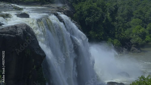 Close up view of Athirapally waterfalls in Kerala India, nayagra of India, river in the middle of rain forest kerala. photo