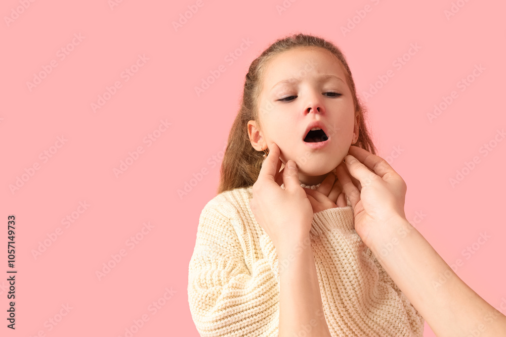 Sick little girl and woman examining sore throat on pink background Sick little girl and woman examining sore throat on pink background