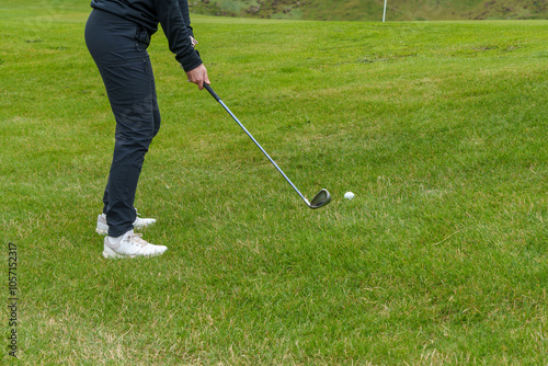 Golfer preparing a shot from the rough