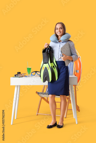 Young businesswoman with la...