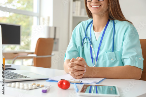 Young female doctor sitting...