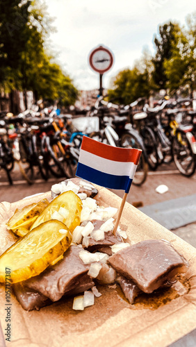 Canvas Print Traditional Dutch herring served with pickles and onions, topped with a Netherlands flag