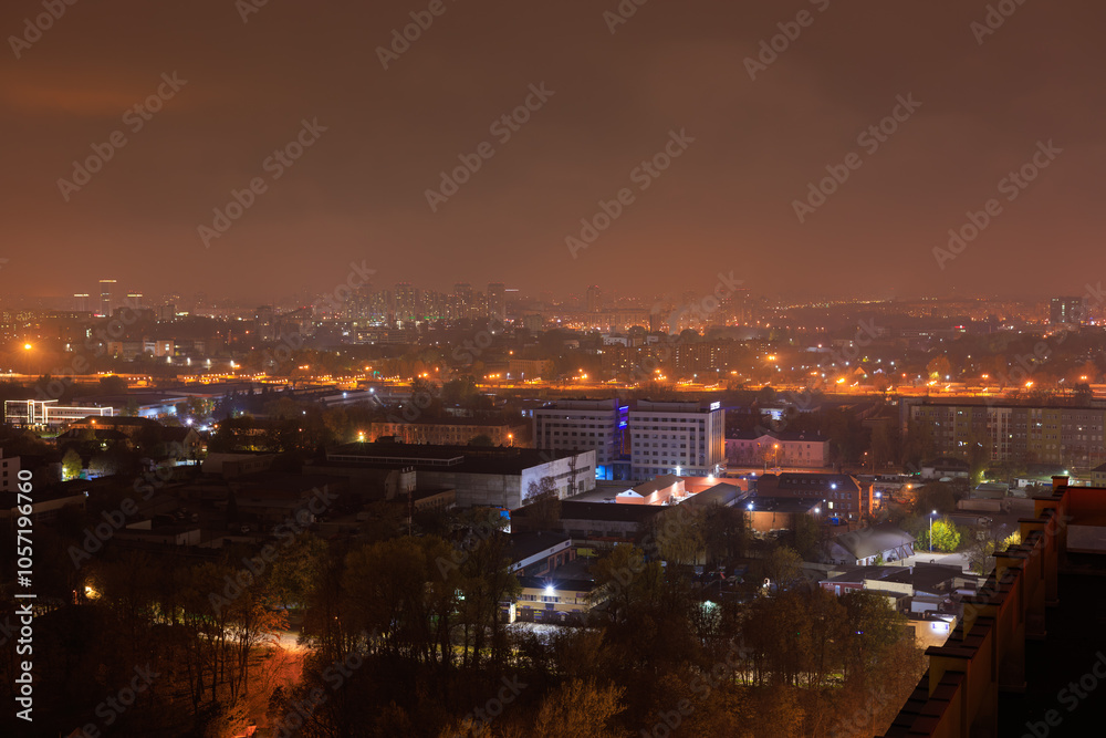 Top view of the night city, lights of lamps and cars in the dark Top view of the night city, lights of lamps and cars in the dark