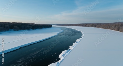 Serene snowy plain with frozen river aerial view