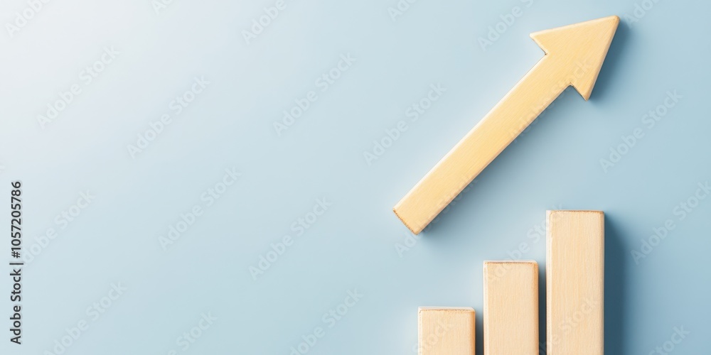 Fototapeta premium Graphical representation of growth with an upward arrow and rising bars on a blue background.