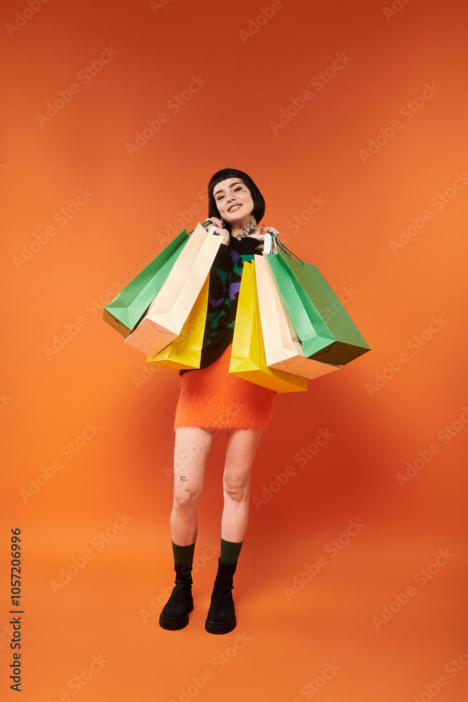 Brightly dressed in a vibrant sweater, she joyfully displays her shopping haul in studio lighting. Brightly dressed in a vibrant sweater, she joyfully displays her shopping haul in studio lighting.