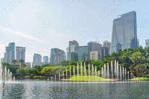 Photography Scenic fountains in a green urban park of Kuala Lumpur