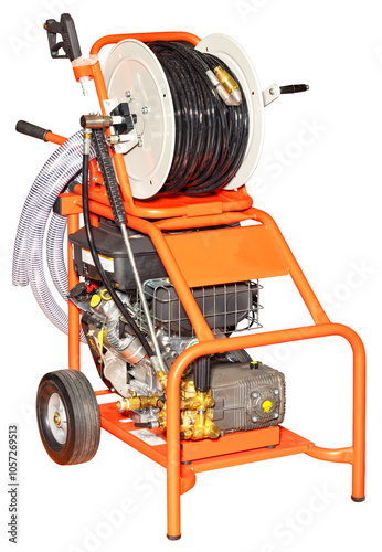 Professional orange high pressure washer with hose reel and spray gun isolated on white background.