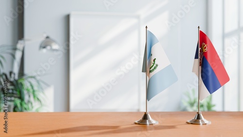 FLAGS OF GUATEMALA AND SERBIA ON TABLE