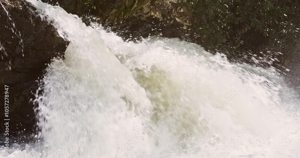 Closeup slow motion shot of a crashing waterfall flowing over the Nantahala River in North Carolina Closeup slow motion shot of a crashing waterfall flowing over the Nantahala River in North Carolina
